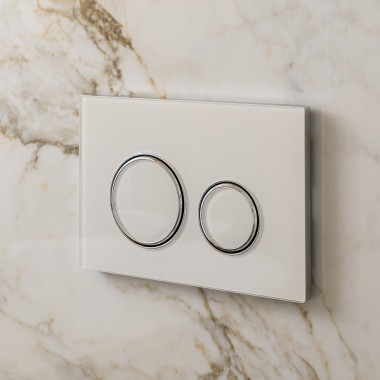 White Geberit Sigma50 actuator plate with design rings in silver White Geberit Sigma50 actuator plate with design rings in silver