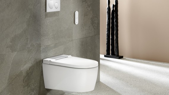 Bathroom with Geberit AquaClean Sela in white and Geberit Sigma20 flush plate