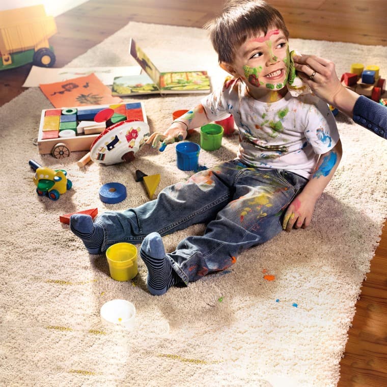 Child covered in paint Child covered in paint