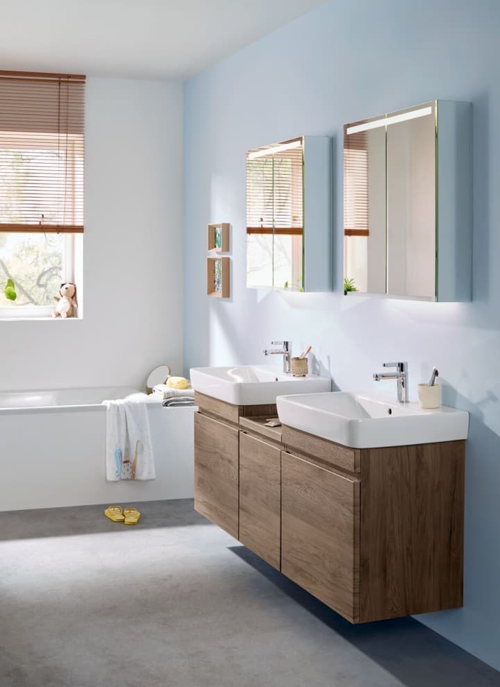 Renova Plan bathroom with two washbasins including washbasin cabinets and low cabinet in hickory Renova Plan bathroom with two washbasins including washbasin cabinets and low cabinet in hickory