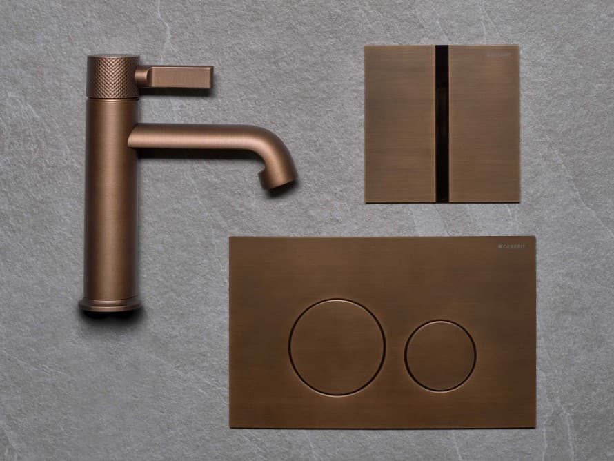 Geberit Sigma40 actuator plate and Type 40 cover plate with perfectly matched finish in brushed copper metal tone