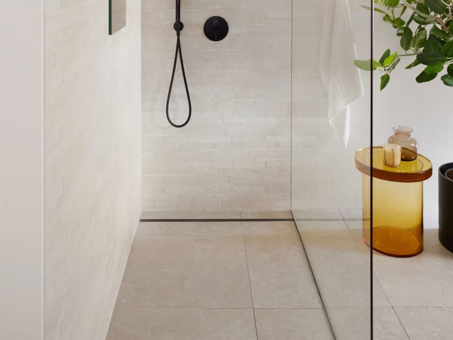 Bathroom with large tiles and floor-even shower