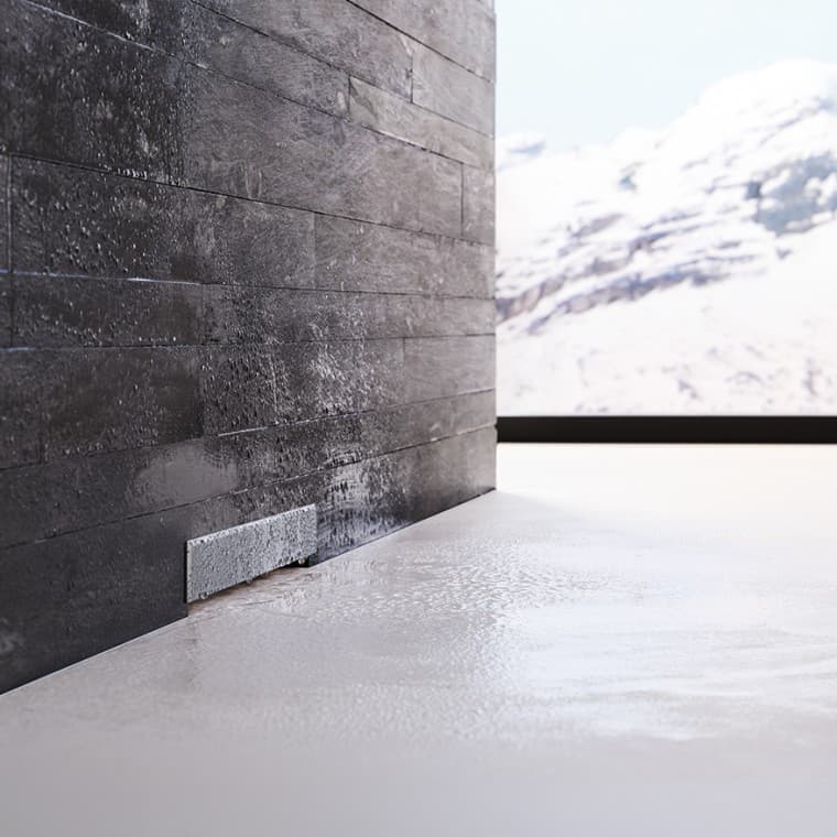 Geberit wall drain in black brick wall Geberit wall drain in black brick wall