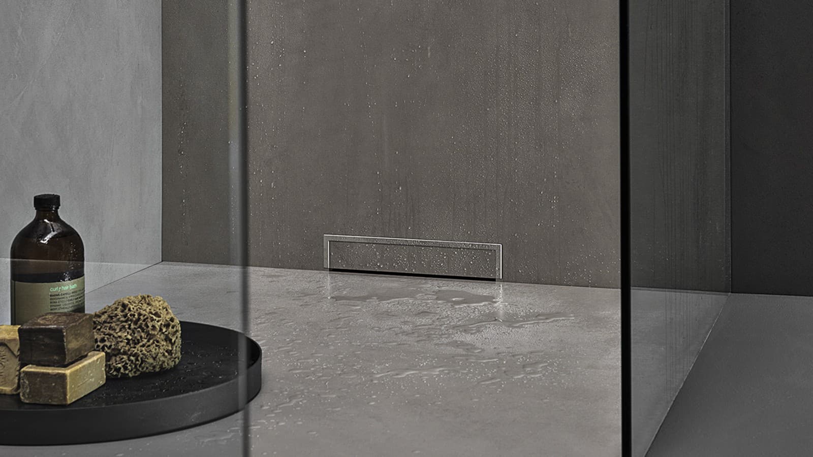 Shower surface with wall drain