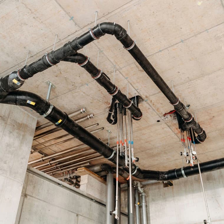 DS 90 residential high-rise: collector pipes in the entrance area DS 90 residential high-rise: collector pipes in the entrance area